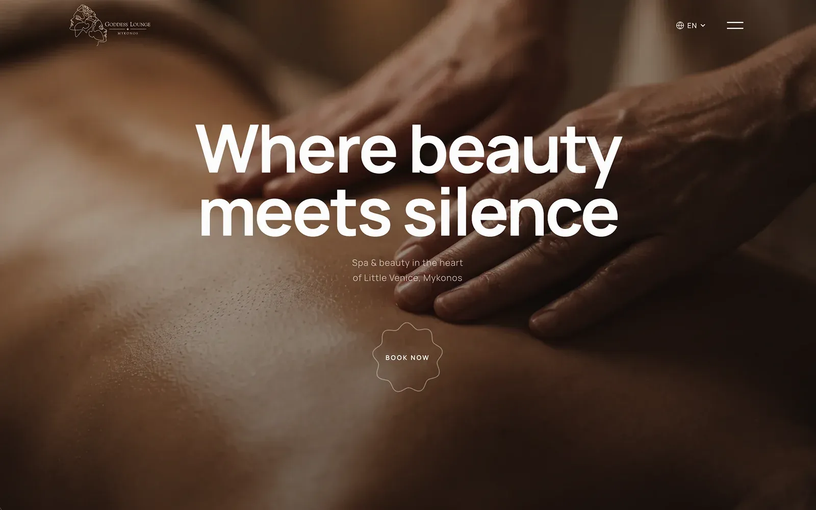 The Goddess Lounge Mykonos homepage: a centred headline over a warm, close-up massage photograph