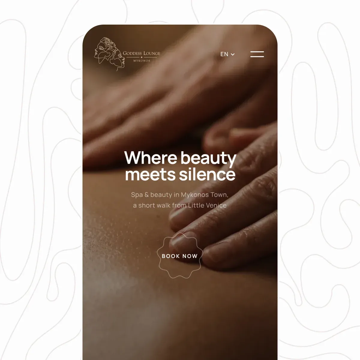 The Goddess Lounge mobile home screen: Where beauty meets silence over a massage photograph, with a Book now seal